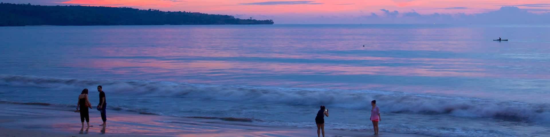 Jimbaran Beach showing a beach and a sunset