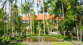 Puri Lukisan Museum which includes a pond, a garden and a luxury hotel or resort