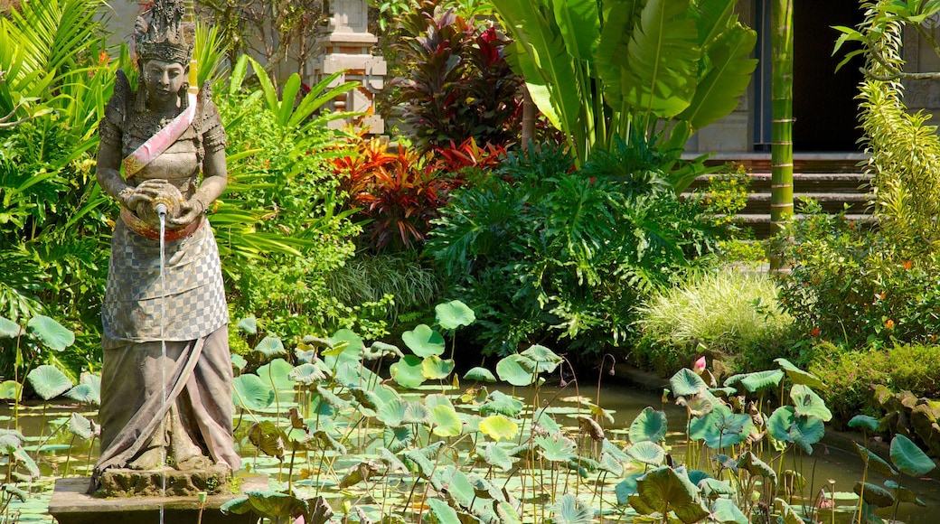 Puri Lukisan Museum showing tropical scenes, a statue or sculpture and a pond