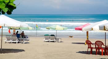 Double Six Beach showing tropical scenes and a beach