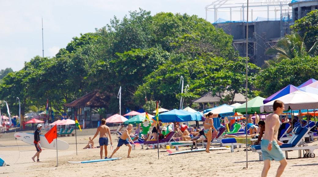 Double Six Beach featuring a sandy beach as well as a large group of people