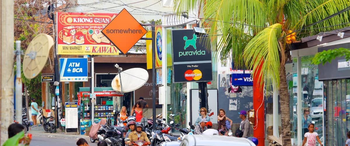 Seminyak which includes a city and street scenes as well as a large group of people