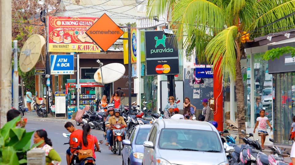 Seminyak which includes a city and street scenes as well as a large group of people