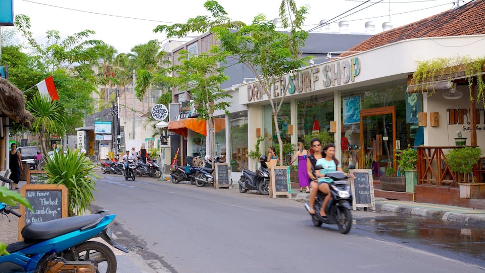 Seminyak featuring street scenes, motorcycle riding and a city