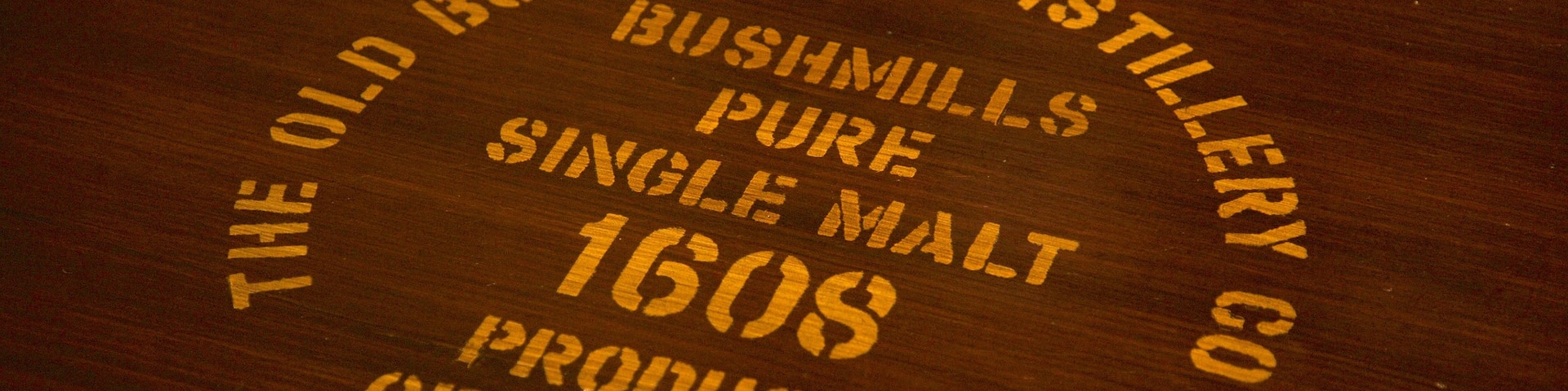 Old Bushmills Distillery featuring signage