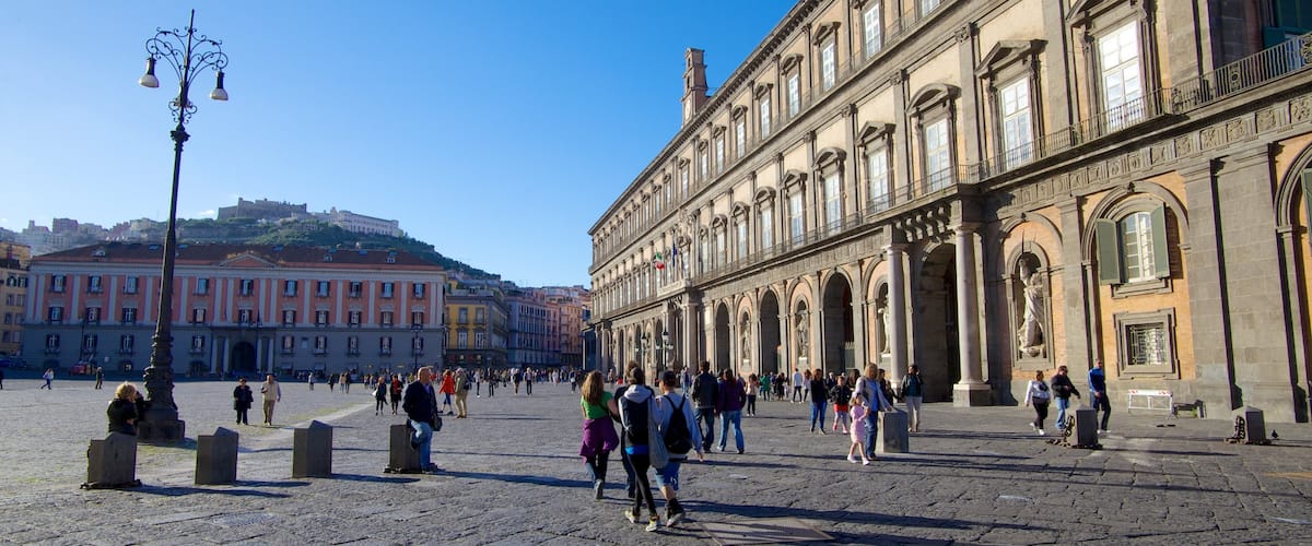 Royal Palace featuring street scenes and a castle as well as a large group of people