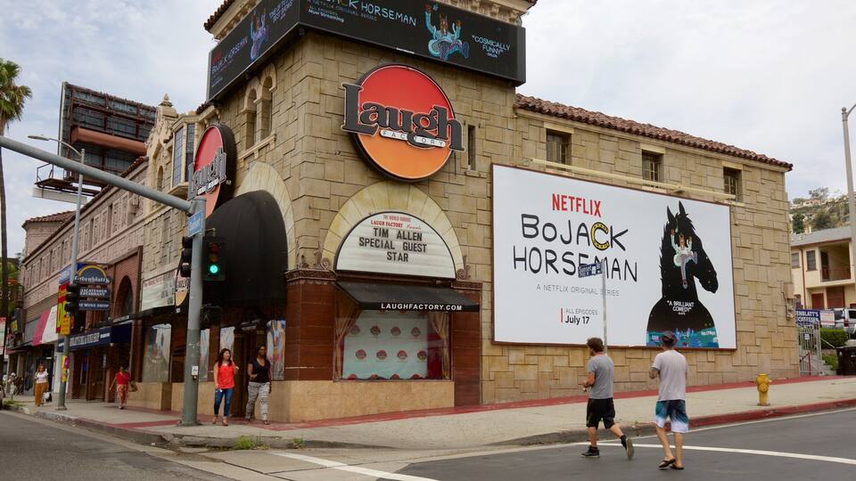 West Hollywood featuring signage and street scenes