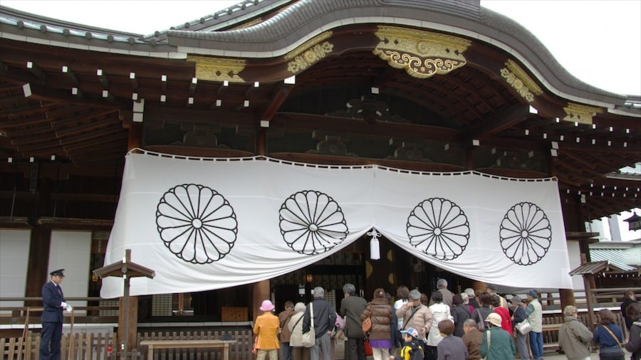Yasukuni Shrine showing religious aspects and a temple or place of worship as well as a large group of people
