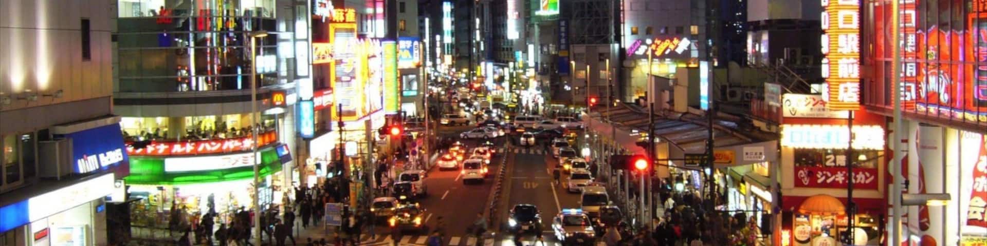 Shinjuku showing a city, night scenes and street scenes