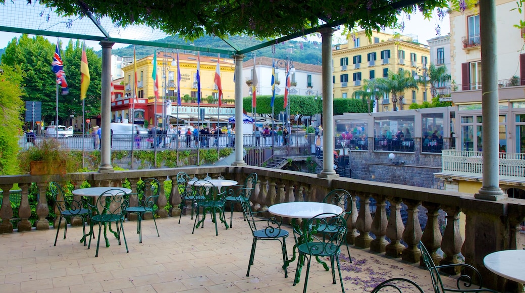 Piazza Tasso showing outdoor eating and a city