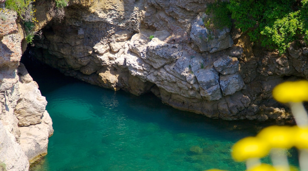 Baths of Queen Giovanna showing caves and rocky coastline