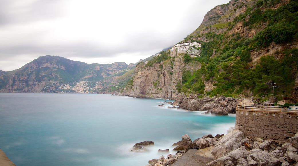 Praiano which includes mountains and rocky coastline