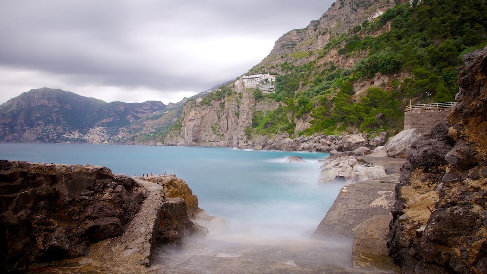 Praiano which includes general coastal views, mist or fog and rocky coastline
