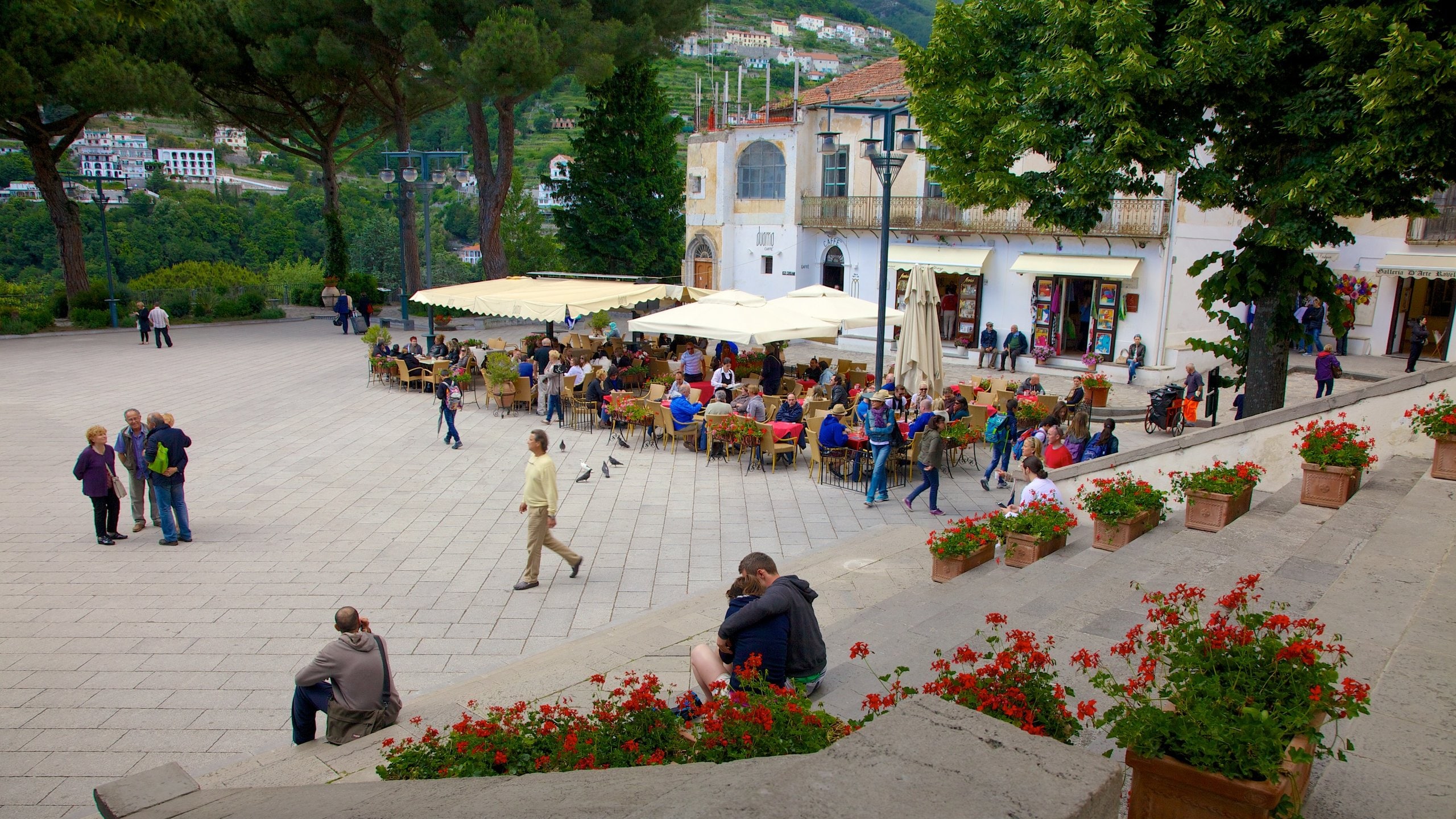Ravello showing a square or plaza as well as a large group of people