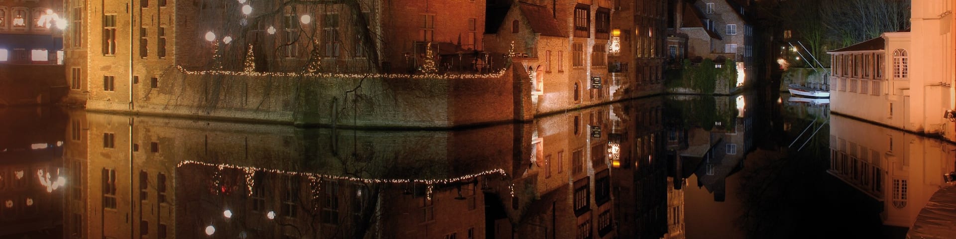 Bruges showing night scenes, mist or fog and a river or creek