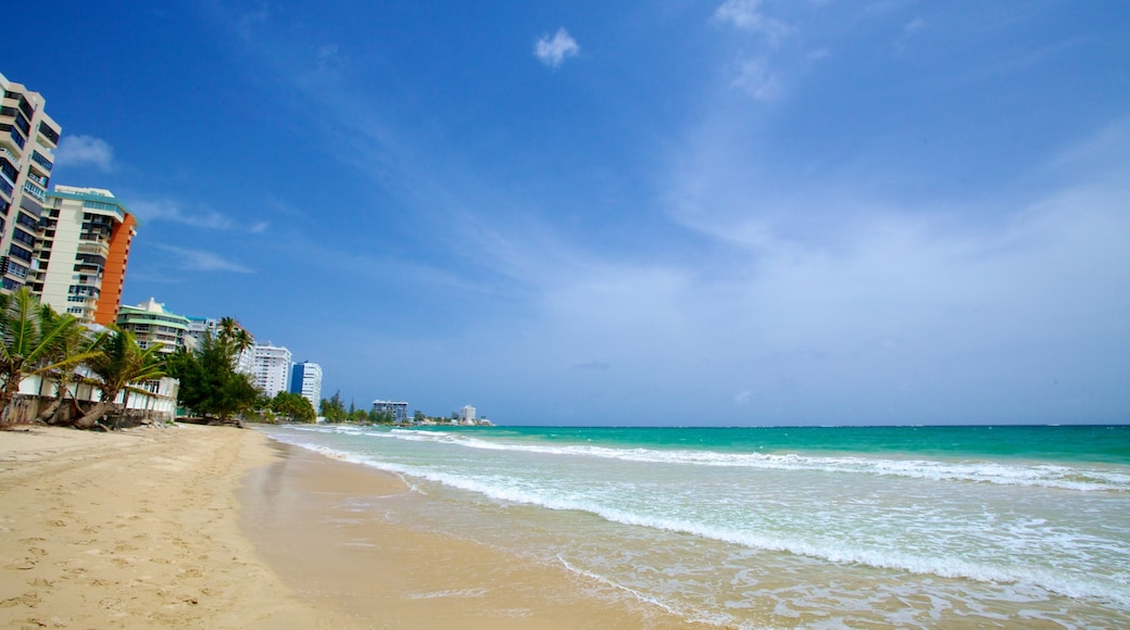 Isla Verde which includes a sandy beach and a coastal town