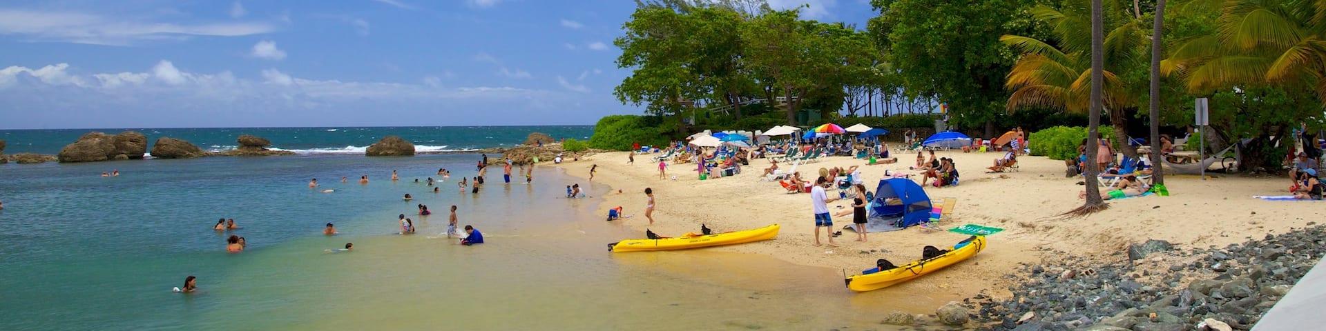 Condado Beach featuring kayaking or canoeing, a sandy beach and tropical scenes