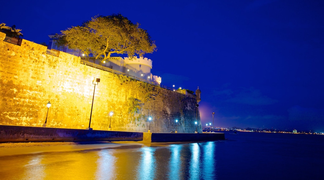 San Juan which includes château or palace, a beach and night scenes