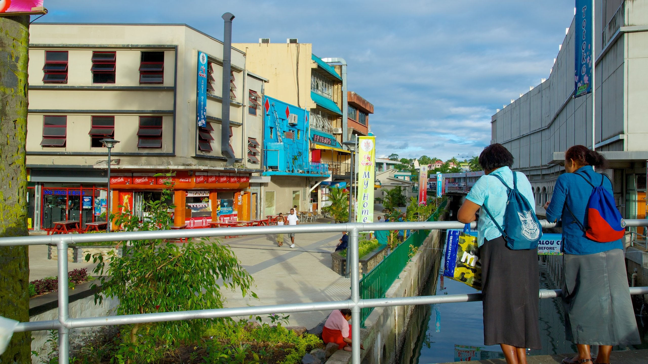 Suva featuring street scenes as well as a small group of people