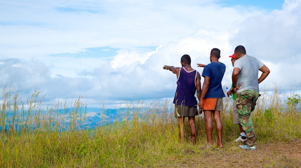 Fiji showing hiking or walking and views as well as a small group of people