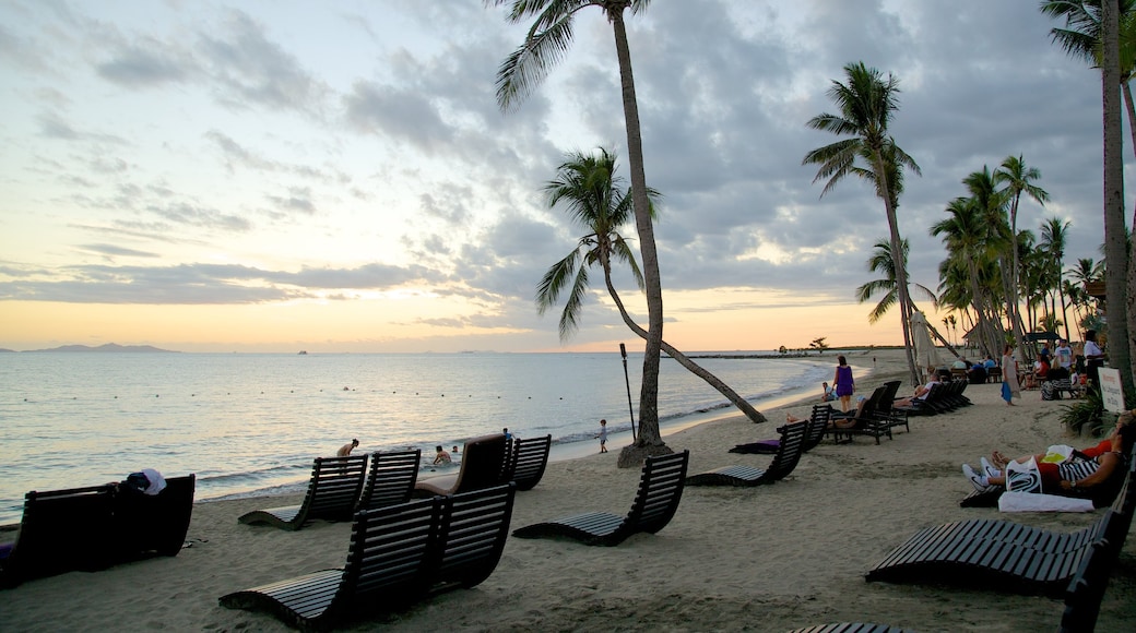 Nadi which includes a beach, a luxury hotel or resort and a sunset