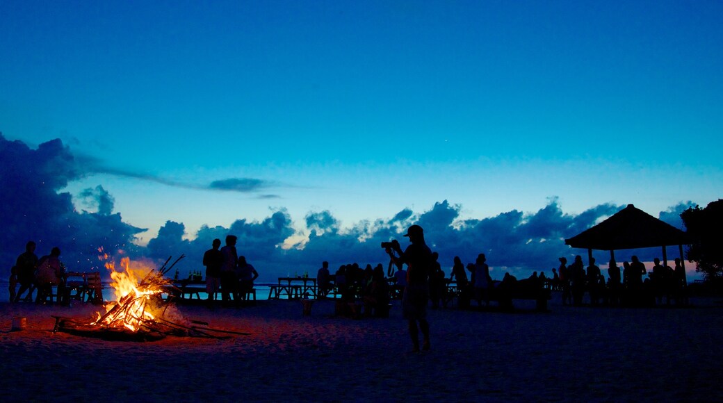 Gili Islands showing night scenes as well as a large group of people