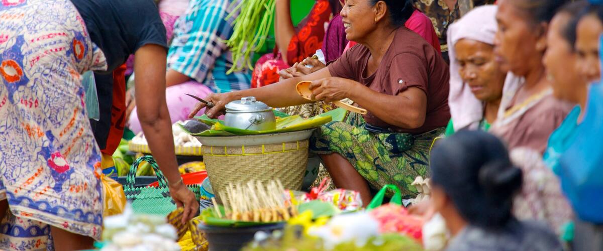 Tanjung which includes markets as well as a large group of people