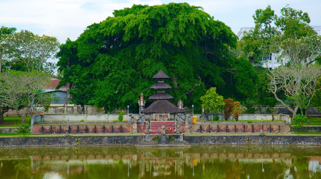 Mayura Temple and Park showing a pond and a temple or place of worship