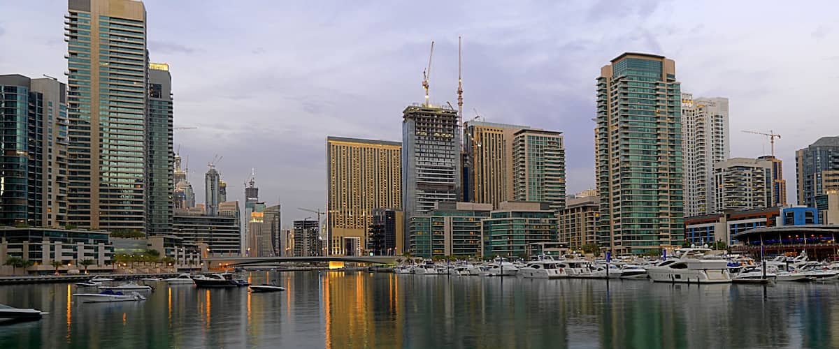 Dubai Marina featuring a marina, a city and skyline