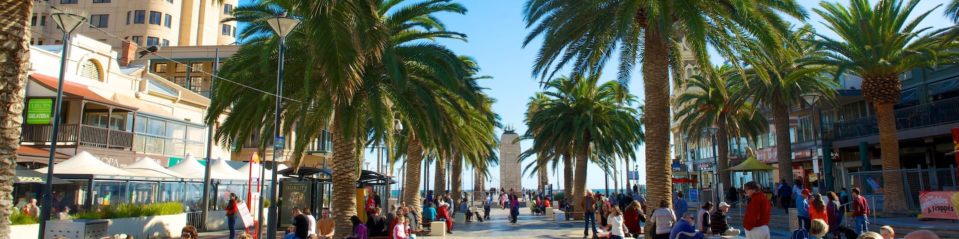 Glenelg Beach which includes a square or plaza as well as a small group of people