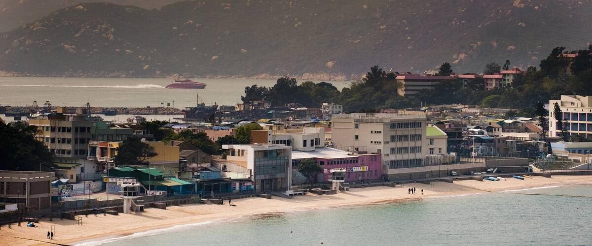 Cheung Chau mostrando spiaggia sabbiosa, località costiera e tramonto