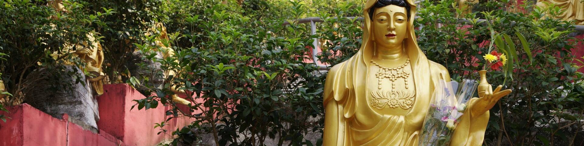 Ten Thousand Buddhas Monastery which includes religious aspects and a statue or sculpture