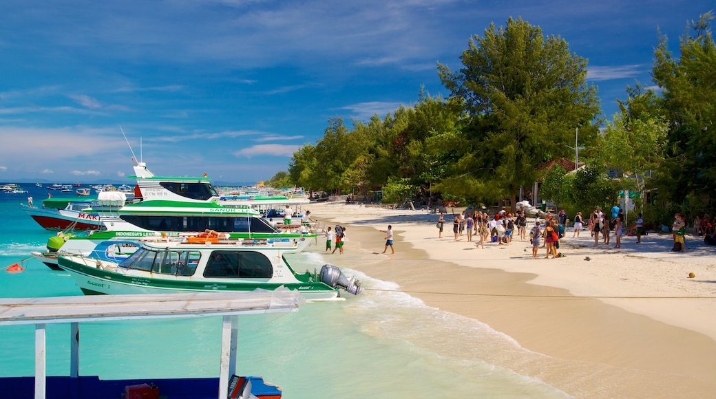 Lombok showing a sandy beach and boating