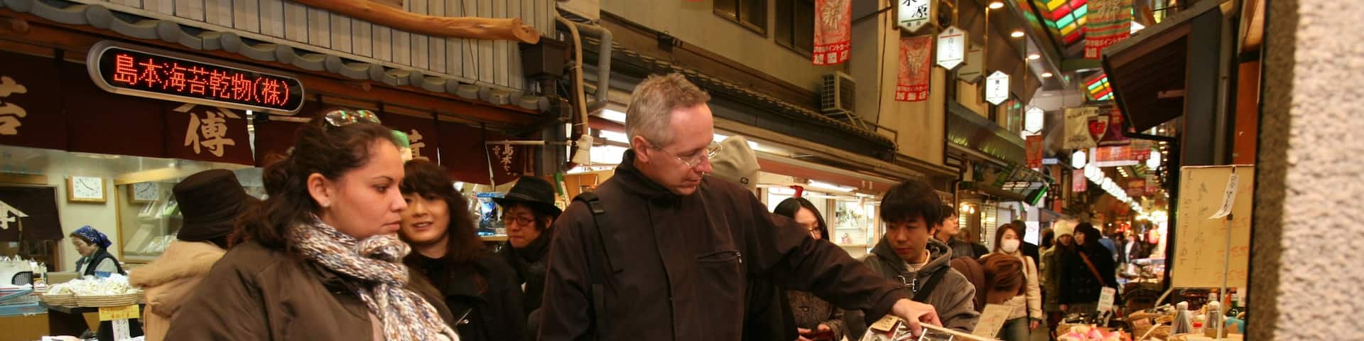 Nishiki Market featuring street scenes and markets as well as a large group of people