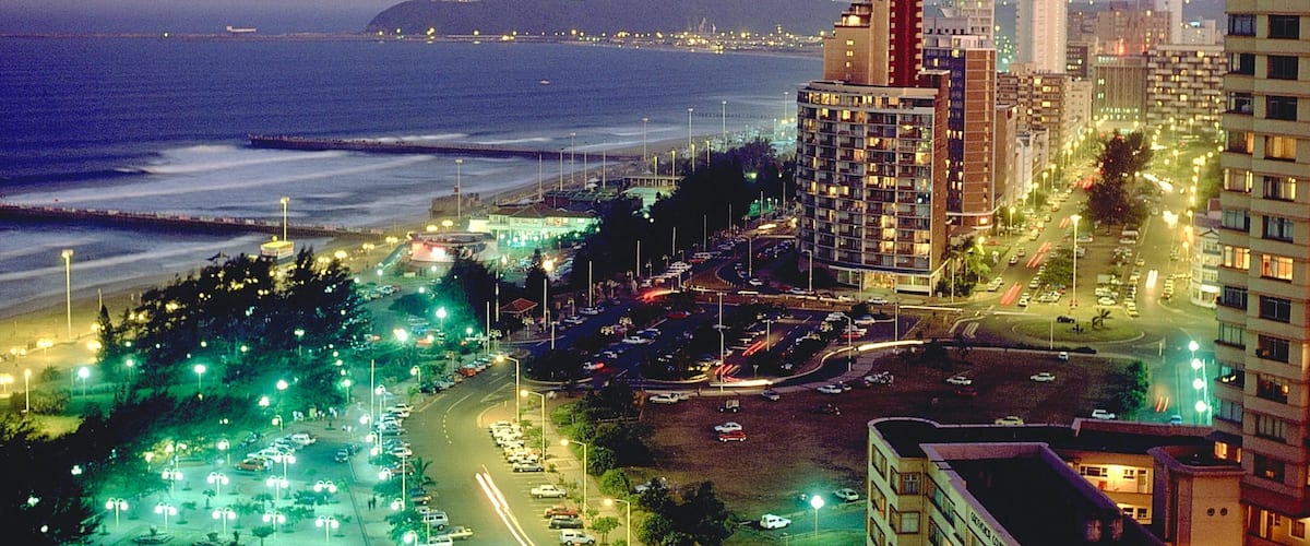 Durban which includes general coastal views, a city and night scenes