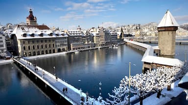 Chapel Bridge which includes a city, street scenes and snow