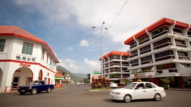 Apia mostrando una ciudad, escenas cotidianas y señalización