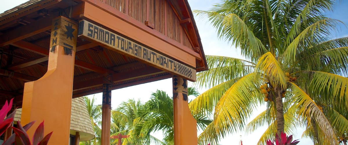 Apia which includes tropical scenes and signage