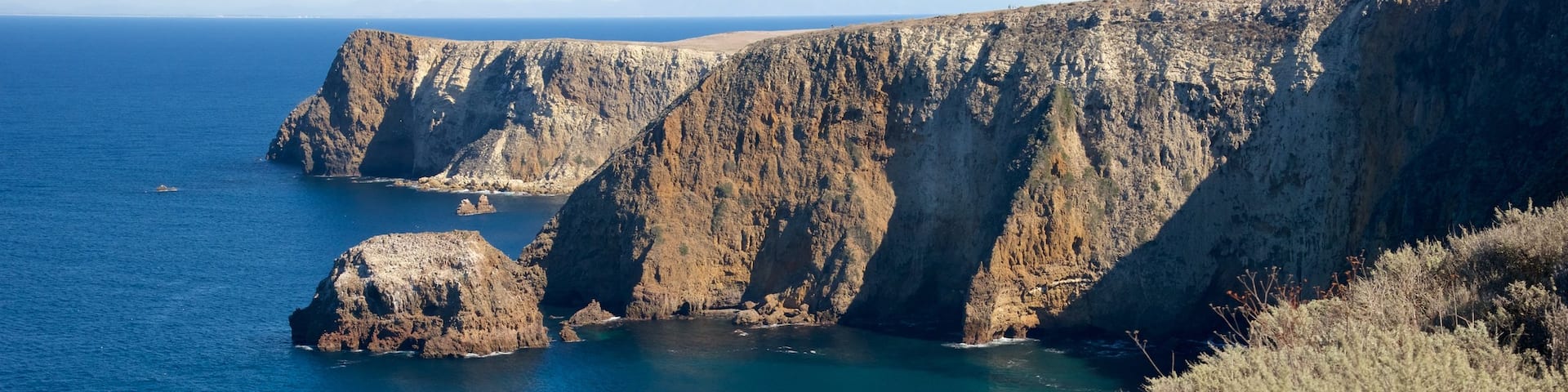 Cavern Point which includes general coastal views and rocky coastline