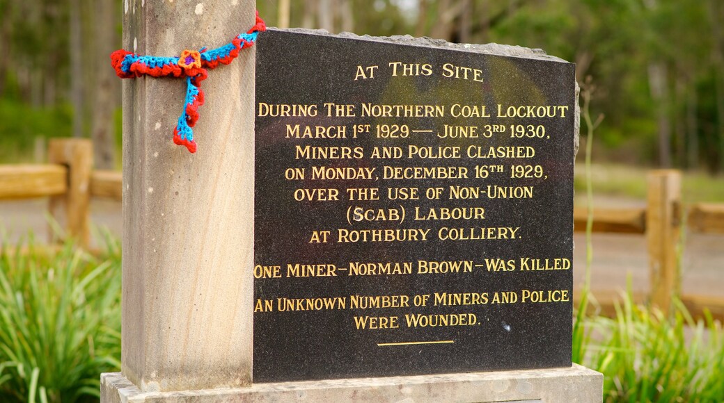 Singleton showing a memorial and signage