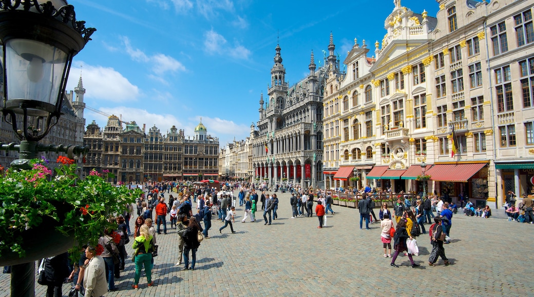 La Grand Place featuring a castle, street scenes and a square or plaza