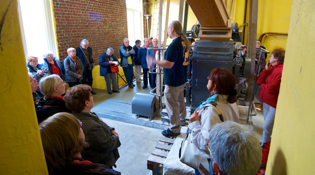 Cantillon Brewery featuring interior views as well as a large group of people