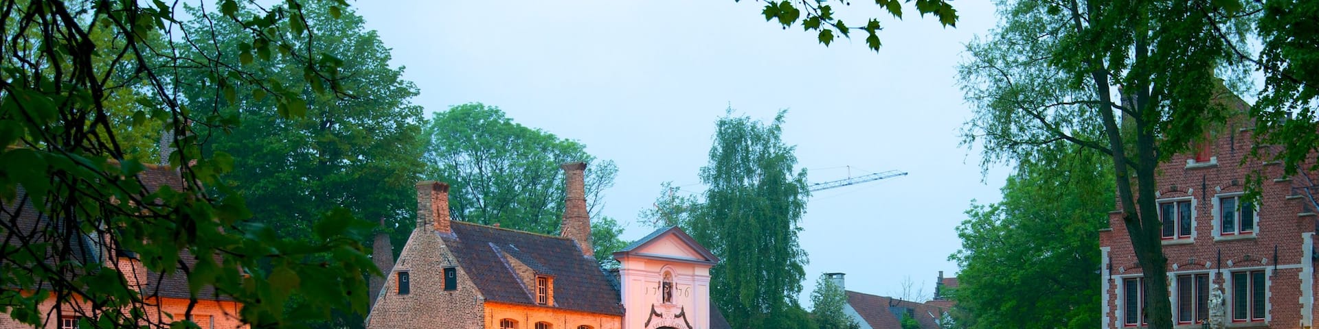 Begijnhof showing a small town or village, a river or creek and a bridge
