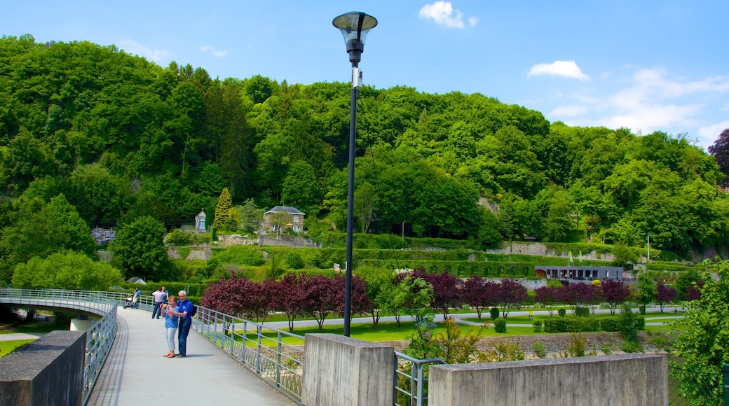 Durbuy featuring a bridge and a garden as well as a couple