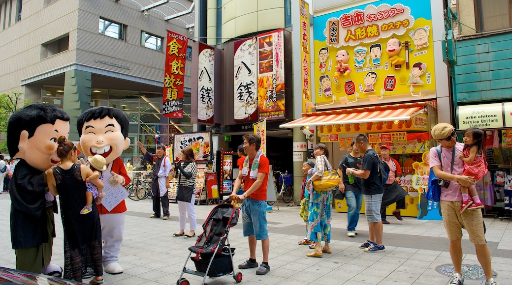 Namba Grand Kagetsu showing a city, signage and street scenes