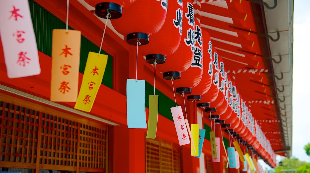 Fushimi Inari Shrine showing signage, a temple or place of worship and heritage architecture