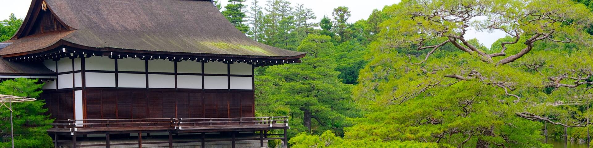 Heian Shrine featuring a pond, a garden and a temple or place of worship