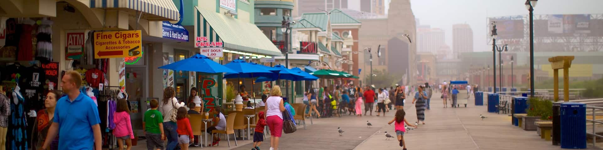 Atlantic City Boardwalk showing street scenes and a city as well as a large group of people