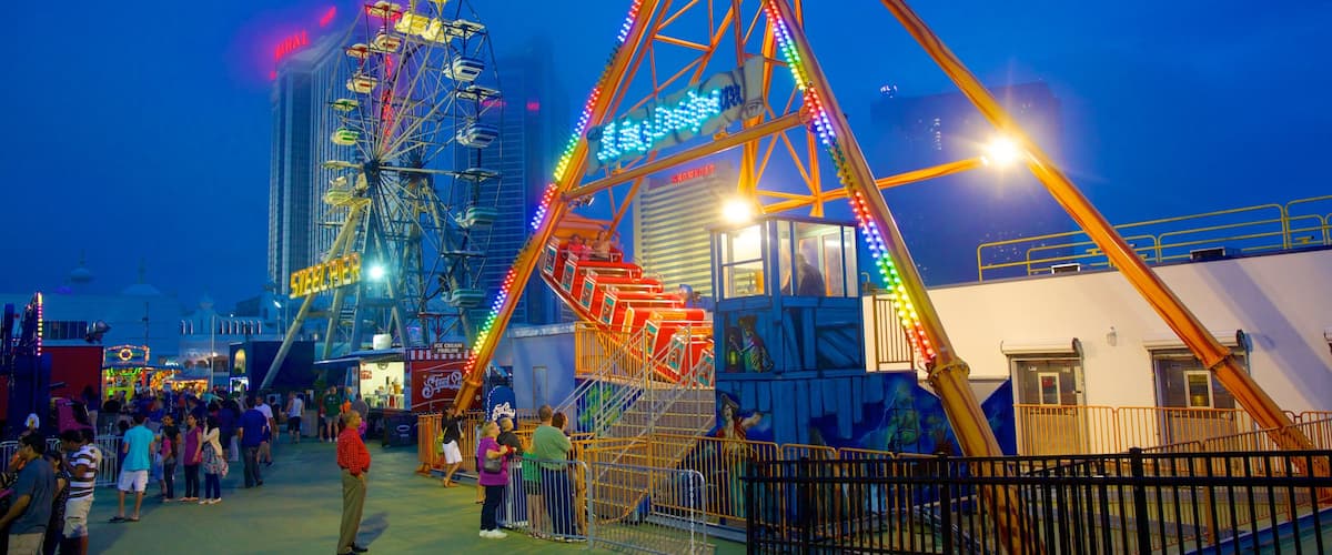 Boardwalk Hall which includes a city, night scenes and rides