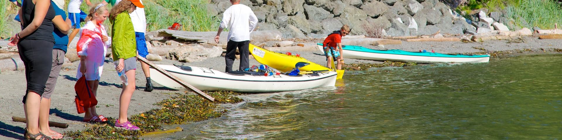San Juan County Park which includes a lake or waterhole as well as a small group of people